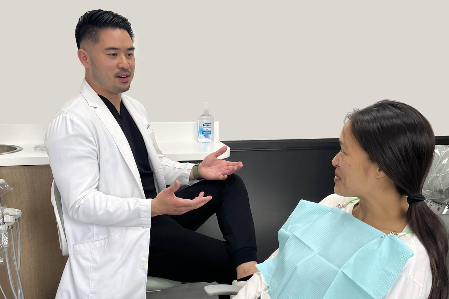 Dr Pham and patient discussing dental care - Dentist in Orange CA
