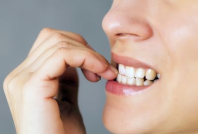 Avoid nail-biting after dental crowns 